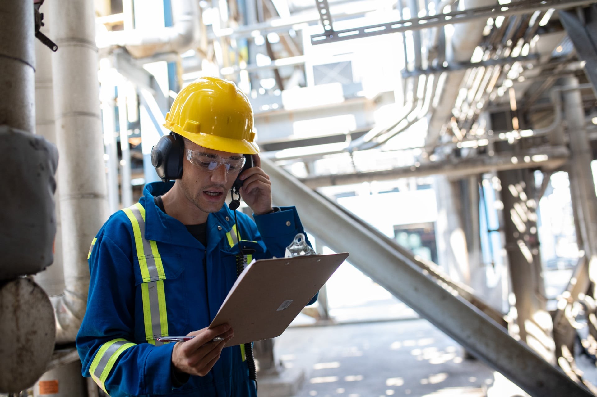 worker using heavy duty headset for intelligent audio