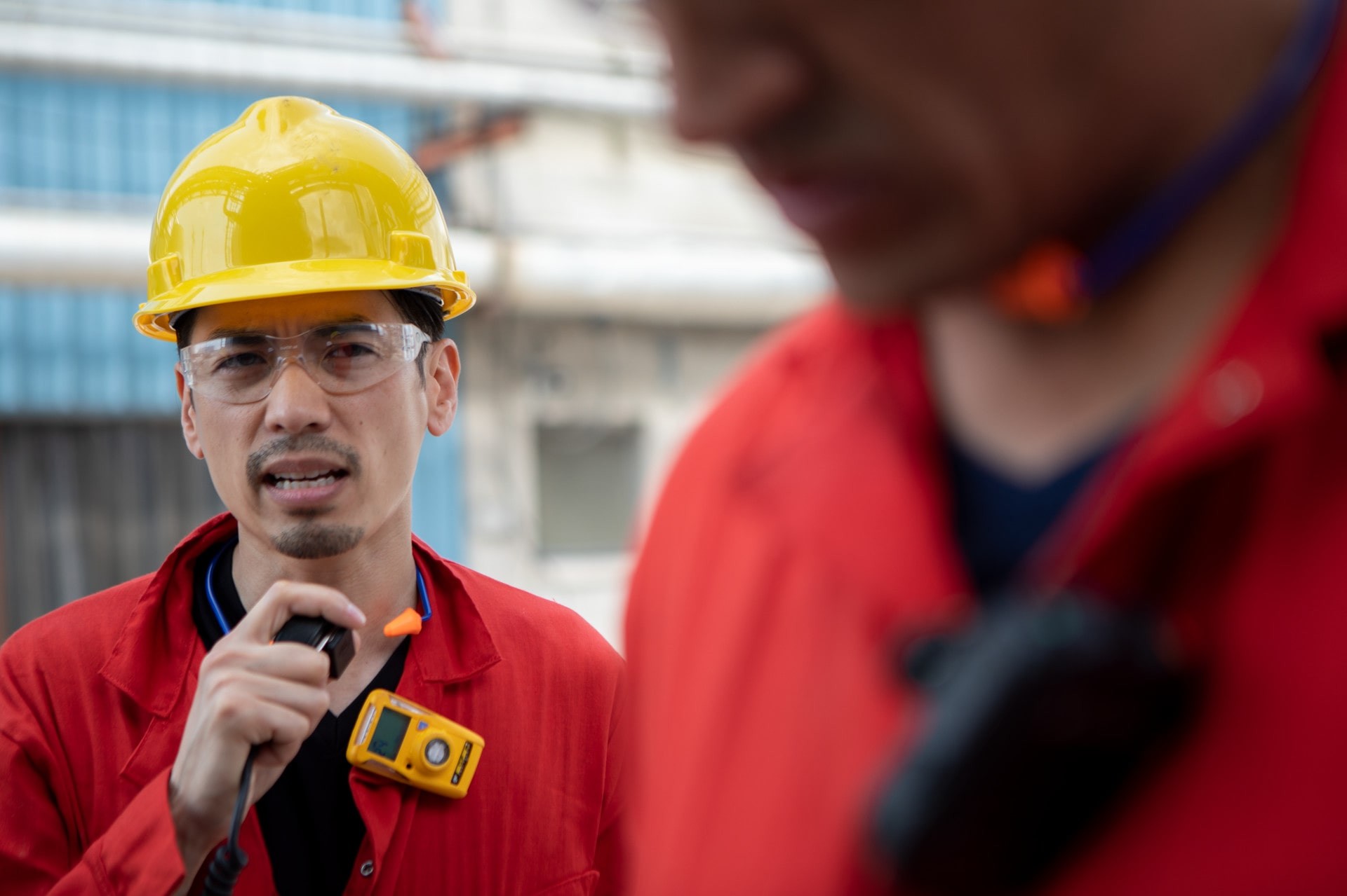 worker using a remote speaker microphone